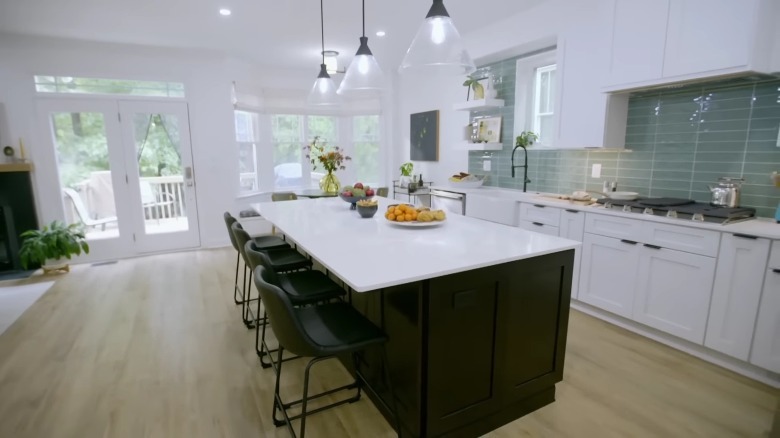 White kitchen with black island