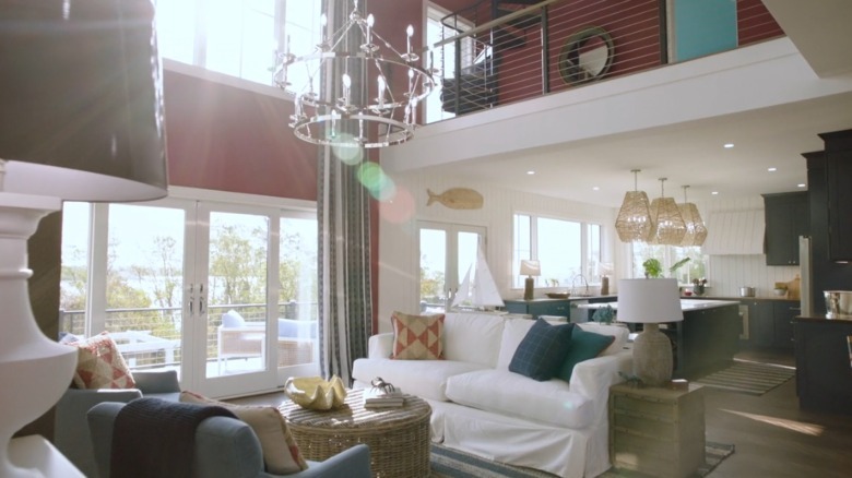 An open living area with red walls in the HGTV Dream House