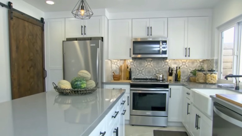 Kitchen with geometric backsplash tiles