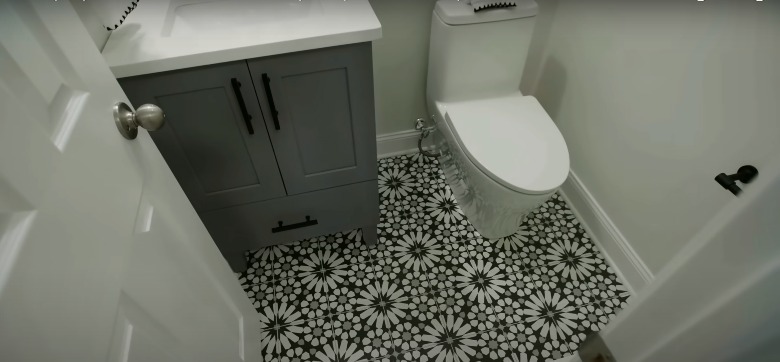 half bathroom with tile floor