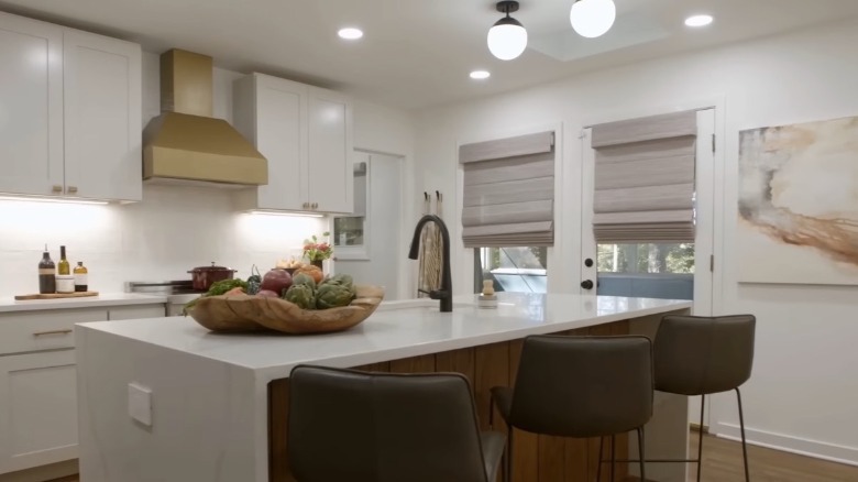 White kitchen with brass hood