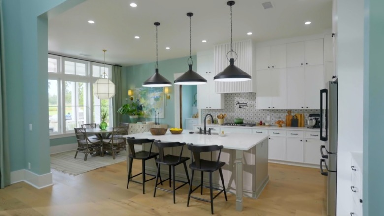 The beachy blue kitchen with white cabinets in the HGTV Dream House