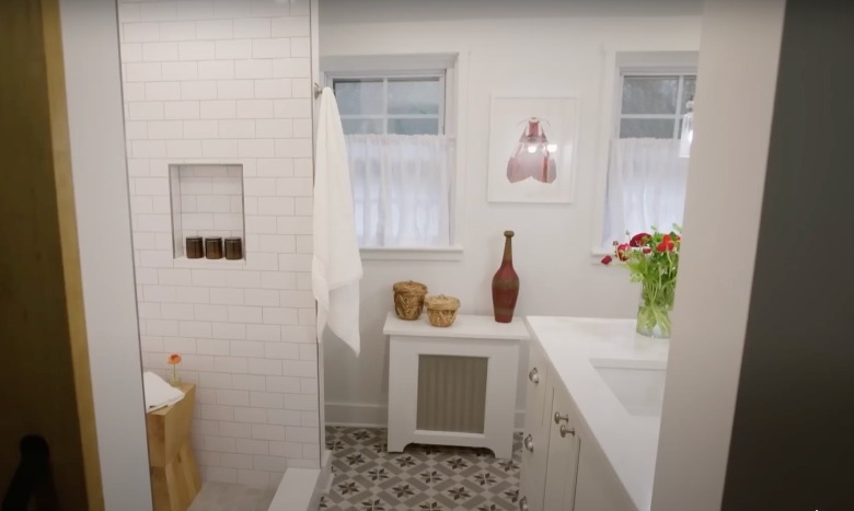 white bathroom with patterned tiles