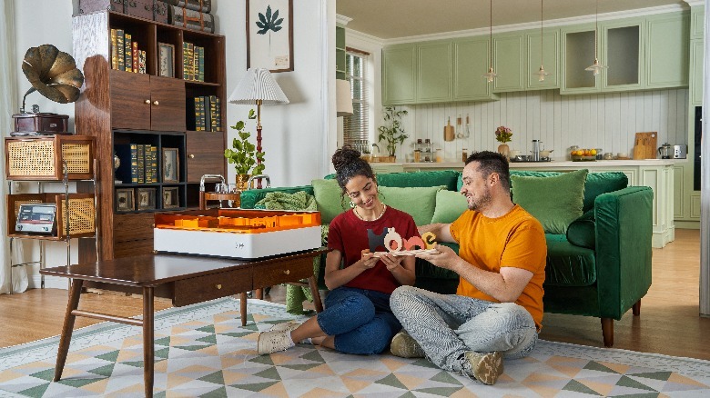 Couple sitting with xTool M1